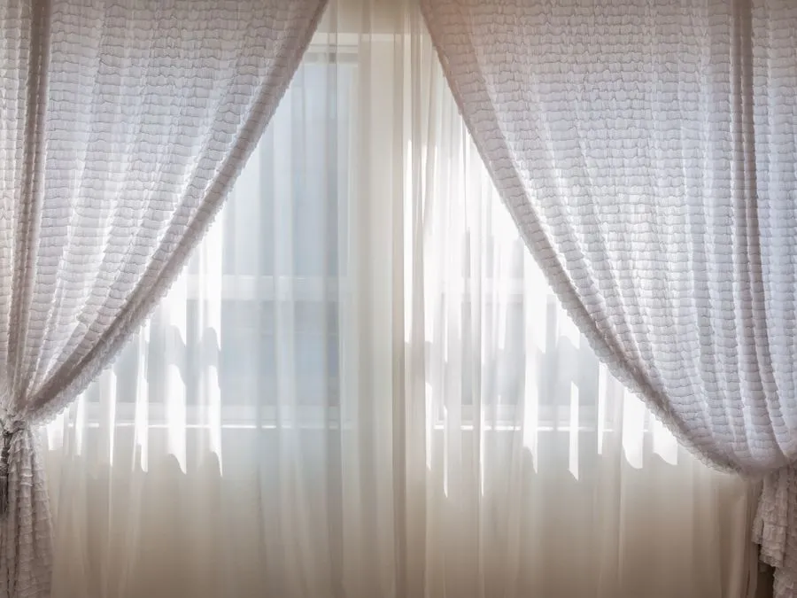 Sheer curtains in sunlight — freshened by Cleanitize curtain cleaning Singapore