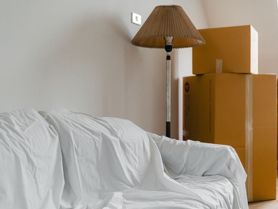 Furniture covered against dust — upholstery deep-cleaned by Cleanitize Singapore