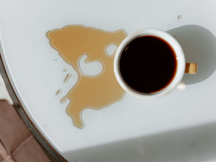 Spilled coffee on a table — food and drink stains treated by Cleanitize Singapore