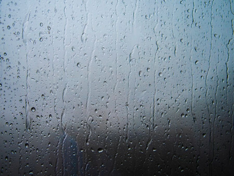 Water streaks on a glass window — cleaned streak-free by Cleanitize Singapore
